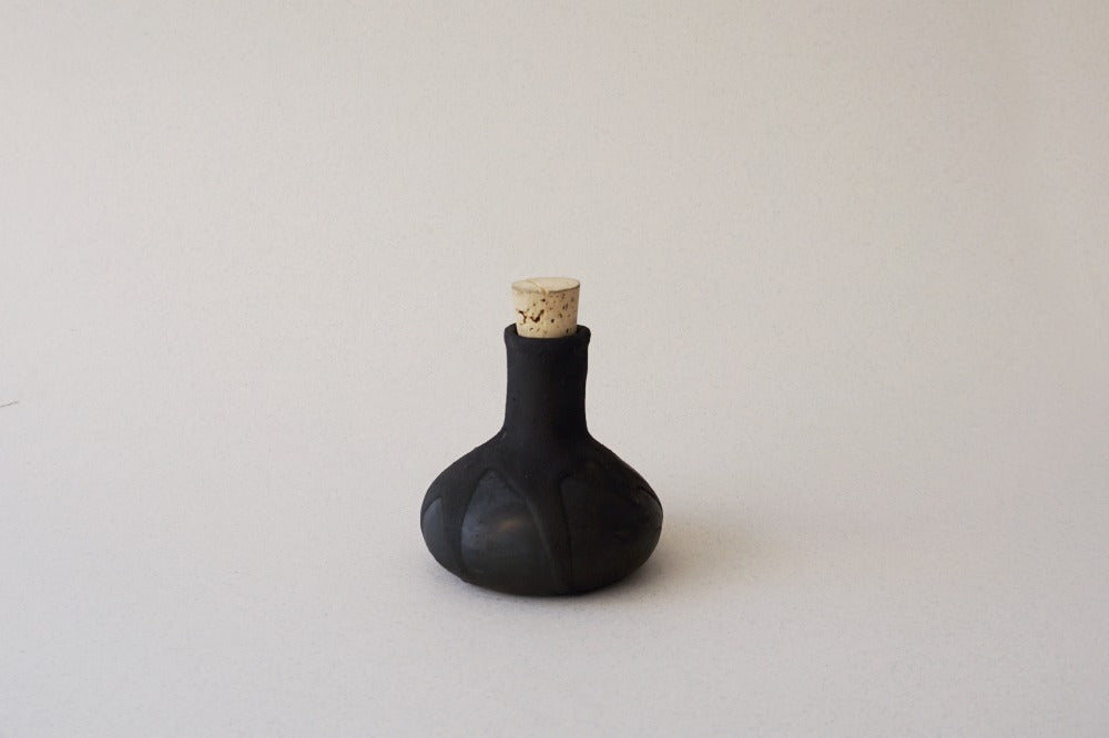 Botella Rosario chica
